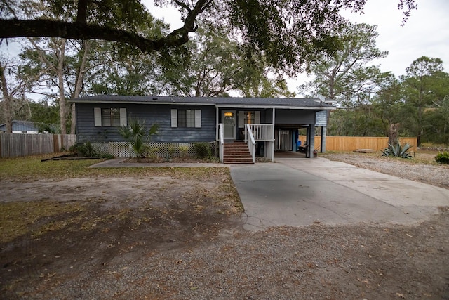 view of front of property with a carport