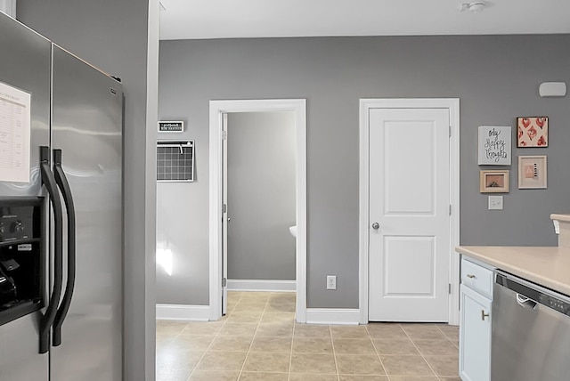 kitchen with light tile patterned flooring and stainless steel appliances