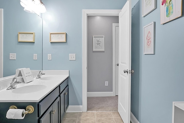 bathroom with tile patterned flooring and vanity