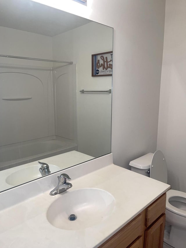 full bathroom featuring vanity and toilet