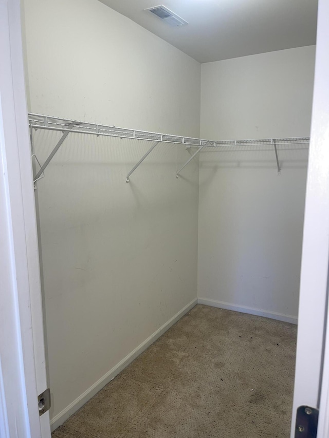 walk in closet with visible vents