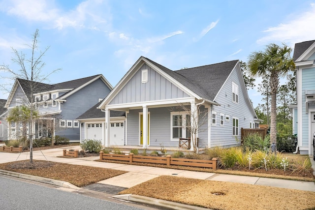 view of front of home featuring a porch and a garage