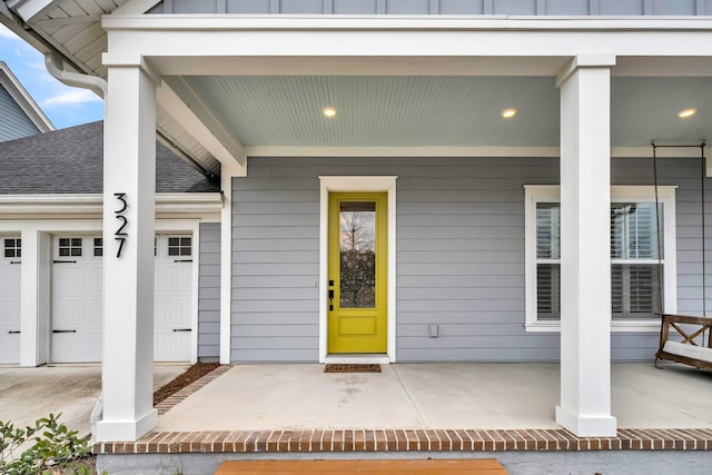 entrance to property featuring covered porch