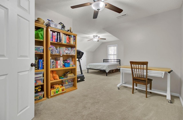 bedroom with ceiling fan, a textured ceiling, light carpet, and vaulted ceiling