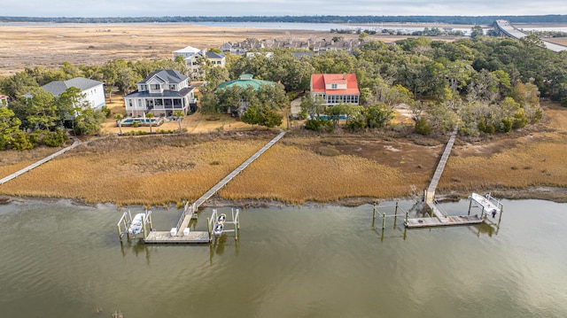 birds eye view of property featuring a water view