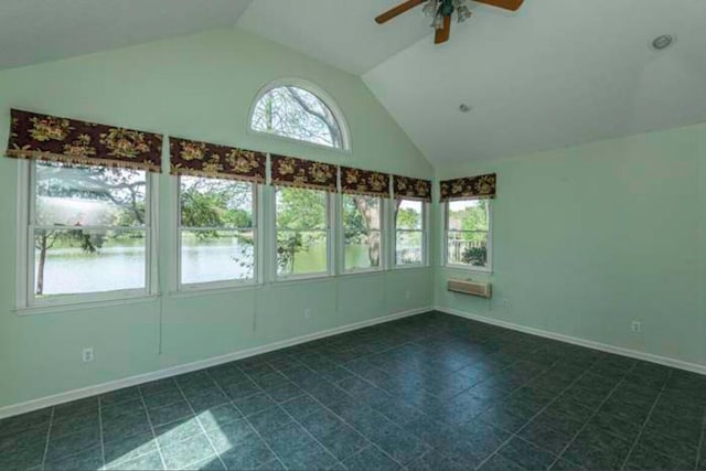 unfurnished sunroom with a water view, ceiling fan, and lofted ceiling