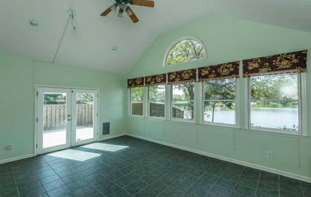 unfurnished sunroom with french doors, a wealth of natural light, and ceiling fan