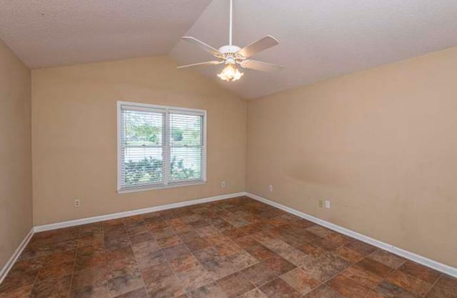 spare room featuring ceiling fan, a textured ceiling, and vaulted ceiling