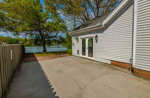 view of patio with a water view