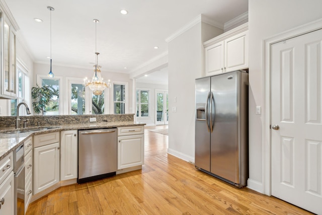 kitchen featuring light hardwood / wood-style floors, sink, appliances with stainless steel finishes, light stone countertops, and white cabinets