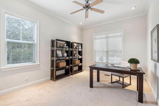 office area featuring light colored carpet, a healthy amount of sunlight, crown molding, and ceiling fan