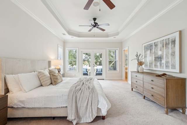 bedroom featuring ornamental molding, ceiling fan, access to exterior, a raised ceiling, and light colored carpet