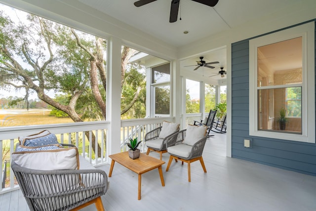 sunroom with plenty of natural light and ceiling fan