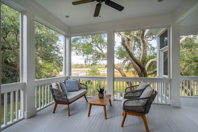 sunroom with a wealth of natural light and ceiling fan