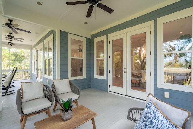 sunroom / solarium with ceiling fan