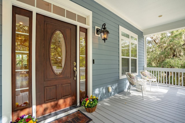 doorway to property featuring a porch