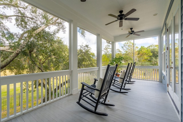 sunroom / solarium with ceiling fan