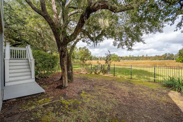 view of yard with a rural view