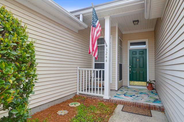 property entrance featuring a porch