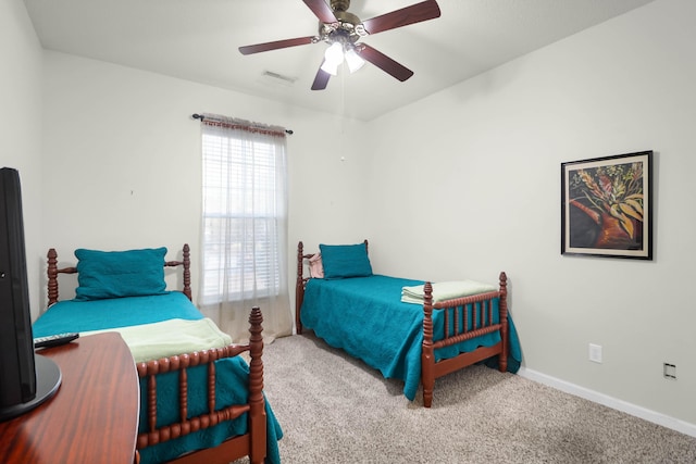 bedroom with visible vents, baseboards, ceiling fan, and carpet flooring