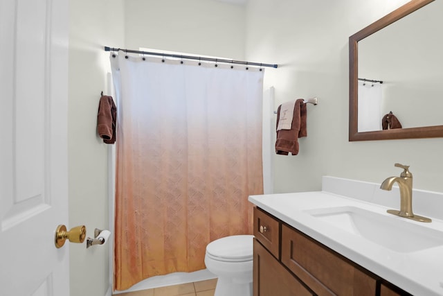 bathroom featuring tile patterned floors, a shower with curtain, toilet, and vanity