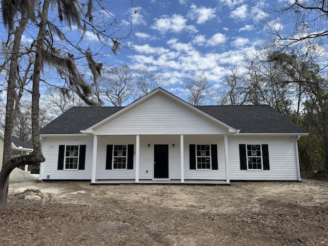 view of front facade with a porch and a shingled roof