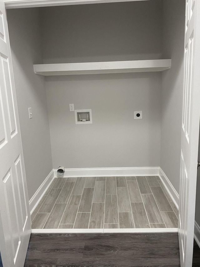 laundry area featuring washer hookup, wood tiled floor, hookup for an electric dryer, laundry area, and baseboards