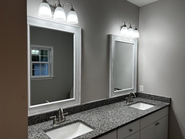 full bath with double vanity and a sink