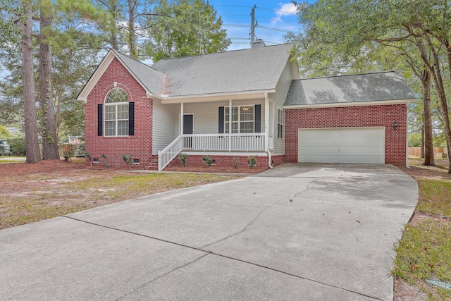 ranch-style home with driveway, crawl space, covered porch, an attached garage, and brick siding