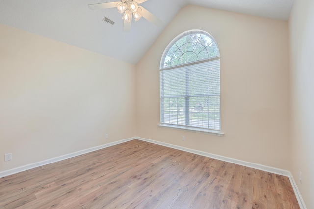 spare room with baseboards, plenty of natural light, visible vents, and a ceiling fan