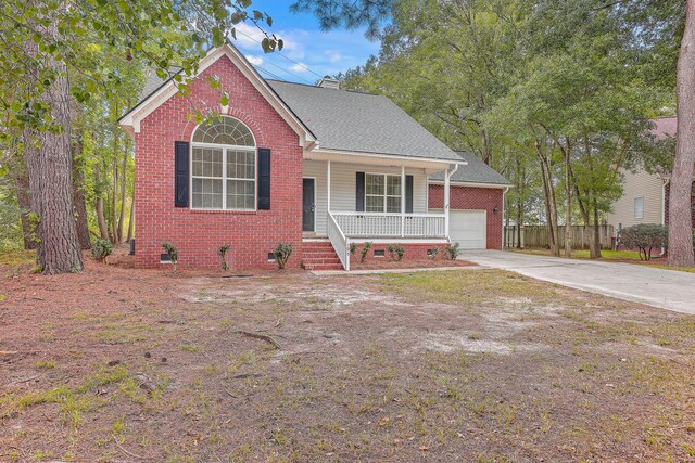 view of front of property with crawl space, driveway, a porch, and brick siding