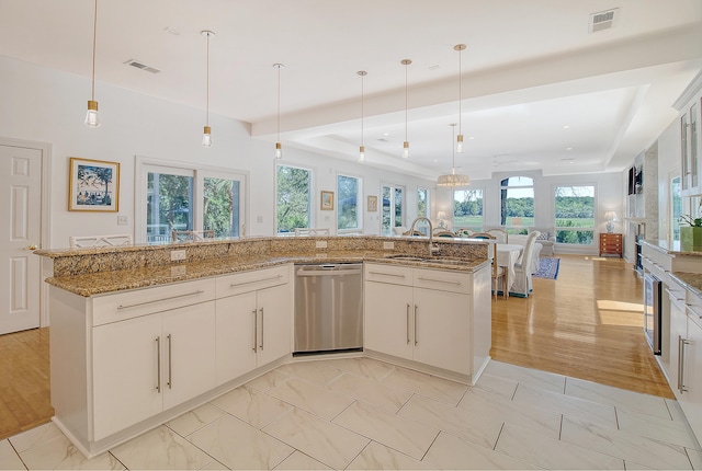5084 Timber Race Crse, Hollywood, SC 29449 - kitchen with stainless steel dishwasher, open floor plan, and hanging light fixtures