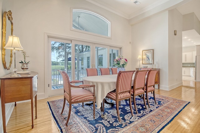5084 Timber Race Crse, Hollywood, SC 29449 - dining space with a high ceiling, light wood finished floors, ornamental molding, and french doors