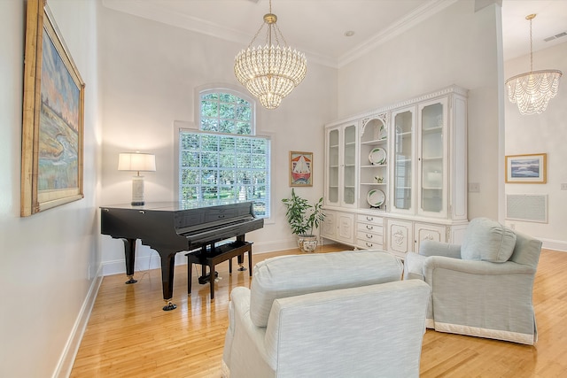 5084 Timber Race Crse, Hollywood, SC 29449 - living area with a chandelier, light wood finished floors, ornamental molding, and a towering ceiling