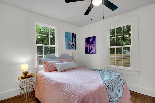 bedroom featuring dark hardwood / wood-style floors and ceiling fan