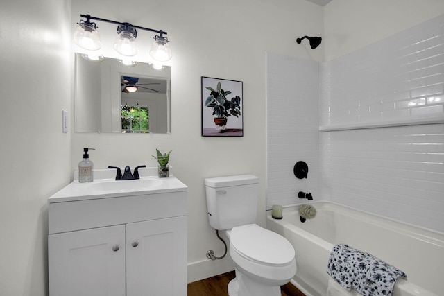 full bathroom with vanity, ceiling fan, washtub / shower combination, hardwood / wood-style floors, and toilet