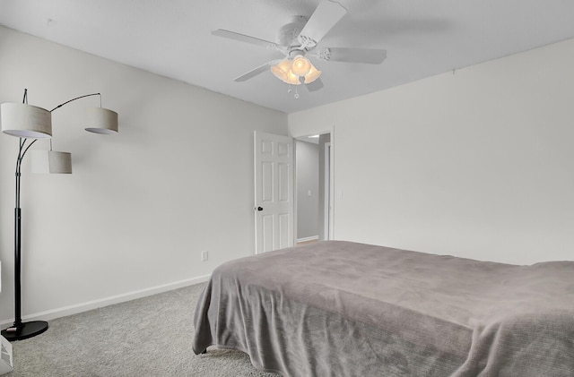 bedroom with carpet, a ceiling fan, and baseboards