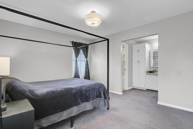 carpeted bedroom featuring baseboards