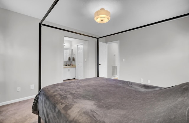 carpeted bedroom with baseboards and visible vents