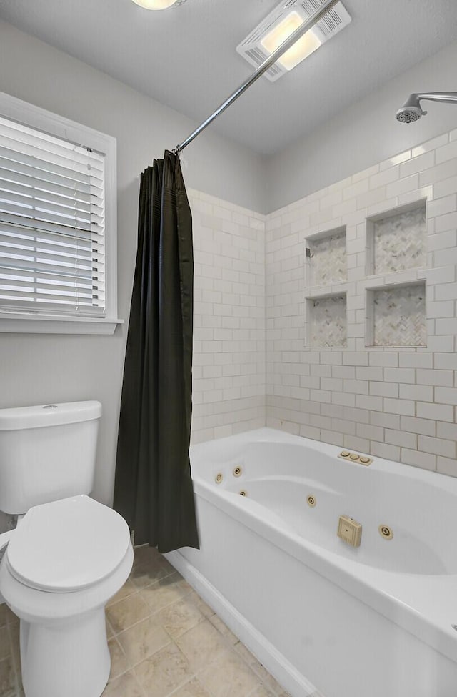 bathroom with toilet, tile patterned flooring, a combined bath / shower with jetted tub, and visible vents