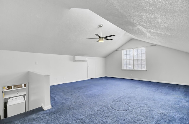 additional living space featuring carpet floors, washer / dryer, a ceiling fan, and a textured ceiling