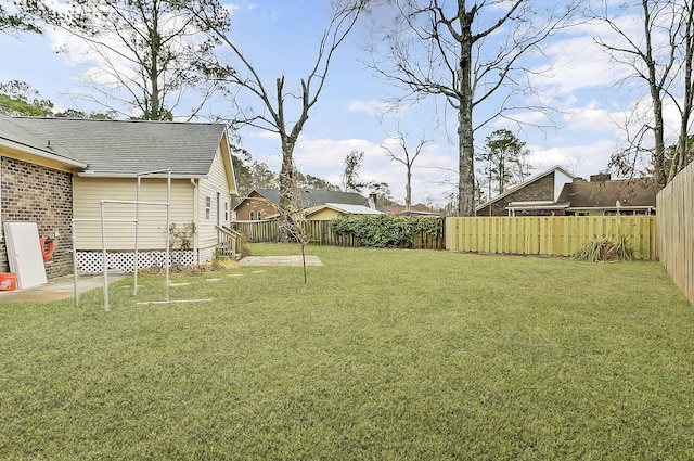 view of yard featuring a fenced backyard