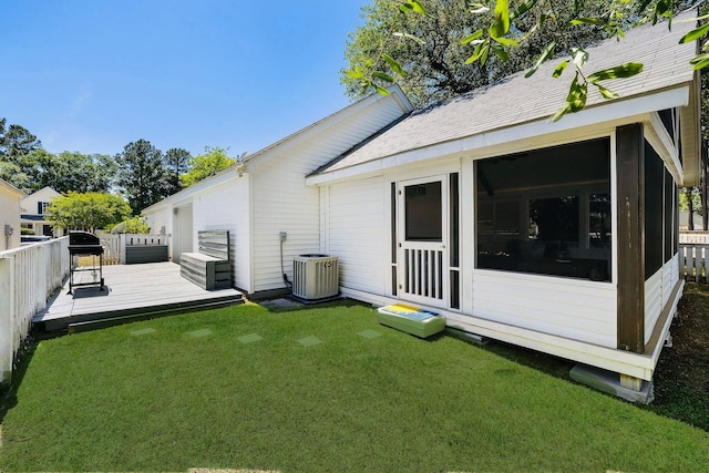 1136 Peninsula Cove Dr, Charleston, SC 29492 - back of property with a sunroom, a wooden deck, a yard, and central AC