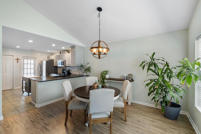 1136 Peninsula Cove Dr, Charleston, SC 29492 - dining space with a chandelier, lofted ceiling, light wood finished floors, recessed lighting, and baseboards