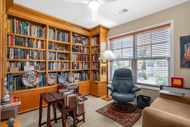 sitting room with light carpet and ceiling fan