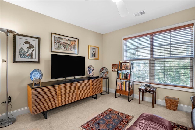 interior space with ceiling fan