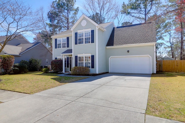 view of front of property with a front yard, fence, an attached garage, a shingled roof, and concrete driveway