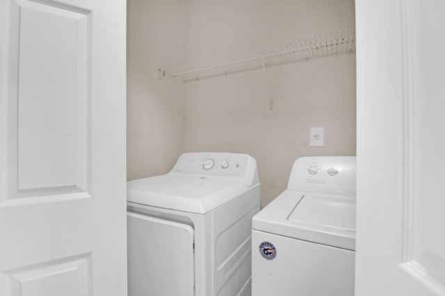 laundry area featuring laundry area and separate washer and dryer