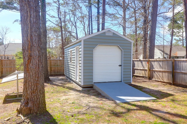 view of shed with a fenced backyard