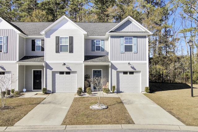 townhome / multi-family property featuring a garage